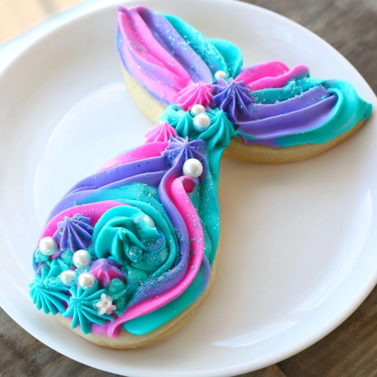 These homemade mermaid tail sweets feature shimmering decorations, a delicious dessert for kids' parties and celebrations.