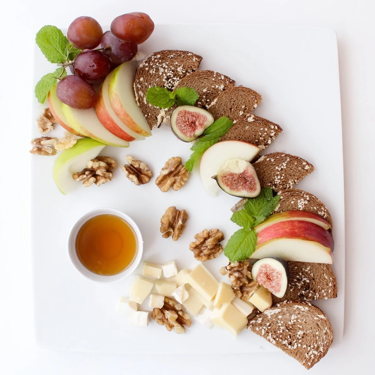 A rustic Harvest Scythe fruit and bread platter overflowing with ripe fruits, grains, and artisan breads.