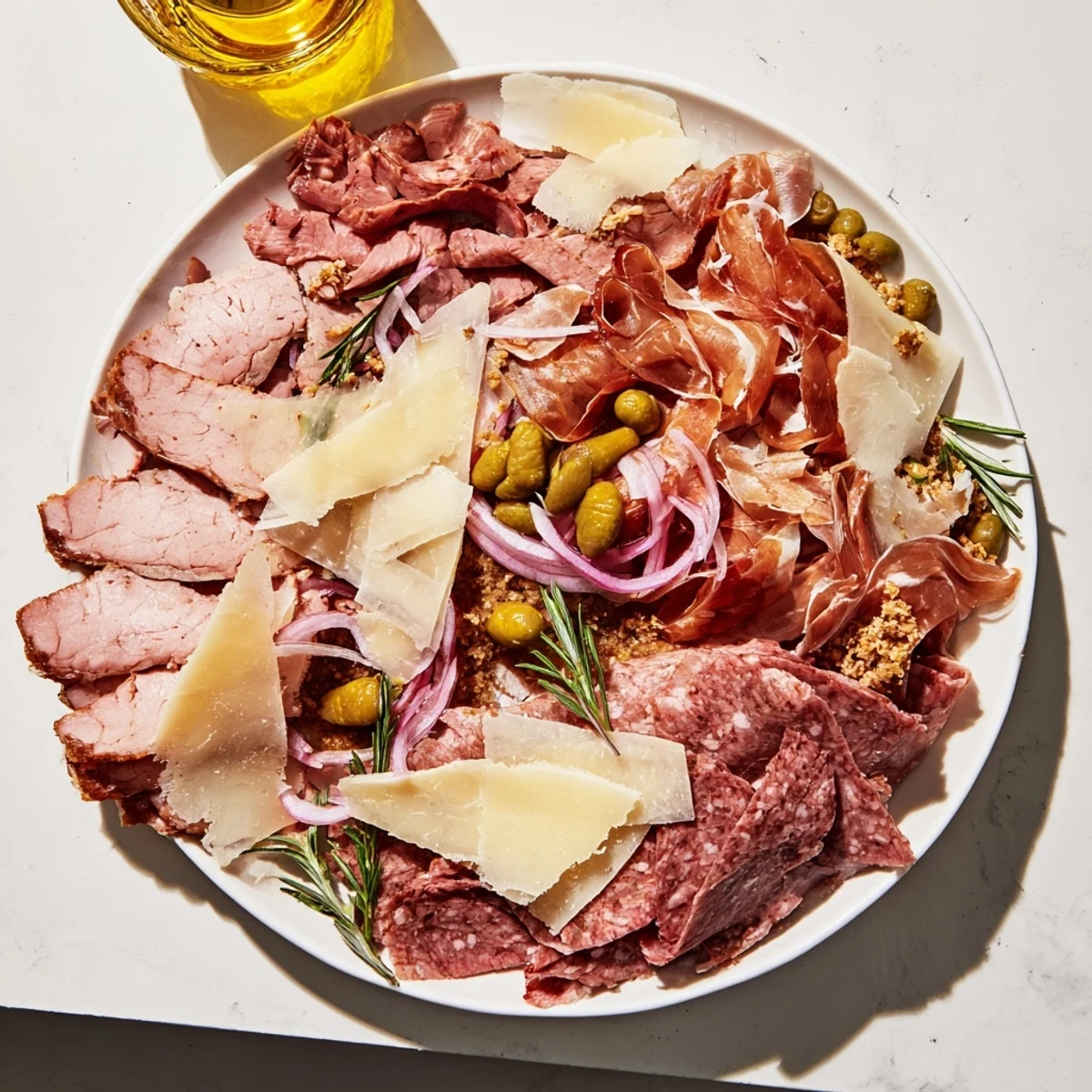 Elegant The Burlap & Lace charcuterie board with cured meats and thinly shaved cheeses presented beautifully.