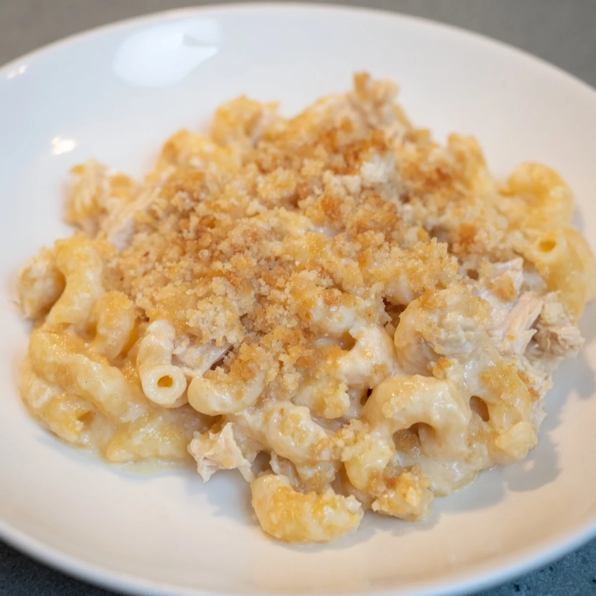 Creamy Struggle Meal Chicken Macaroni bake bubbling in a baking dish, ready to be served.