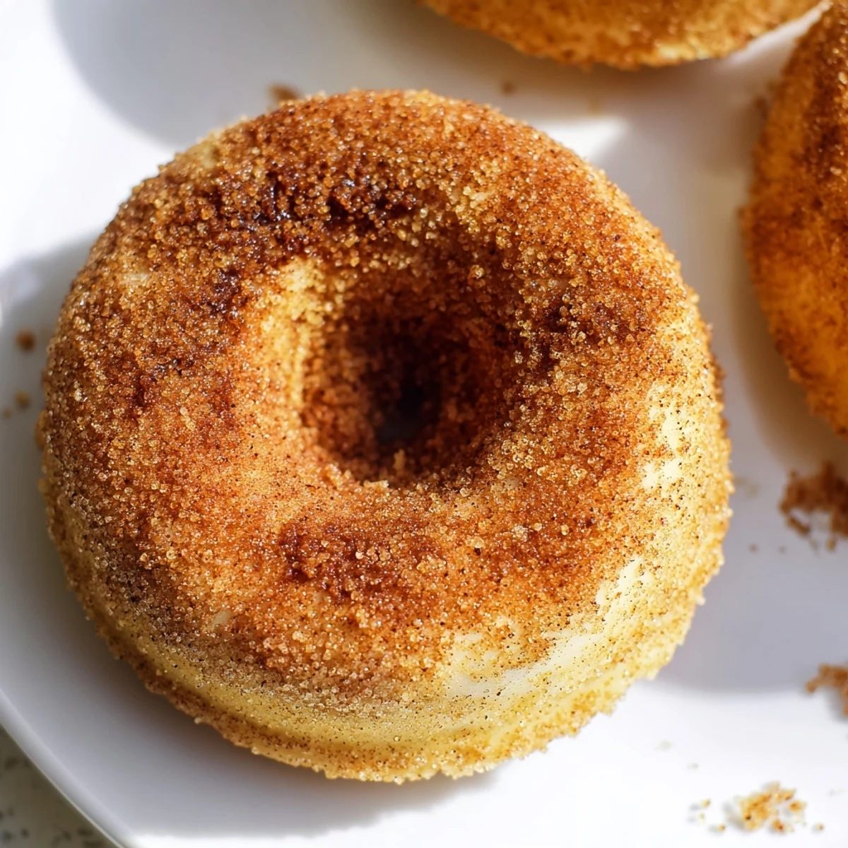 Golden-brown cinnamon-sugar baked donuts, a simple recipe perfect for breakfast or dessert.