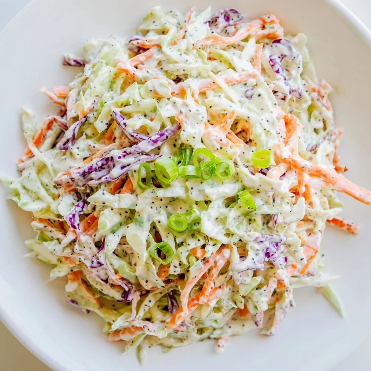 Freshly-made quick coleslaw salad with creamy dressing, a vibrant and colorful side dish.