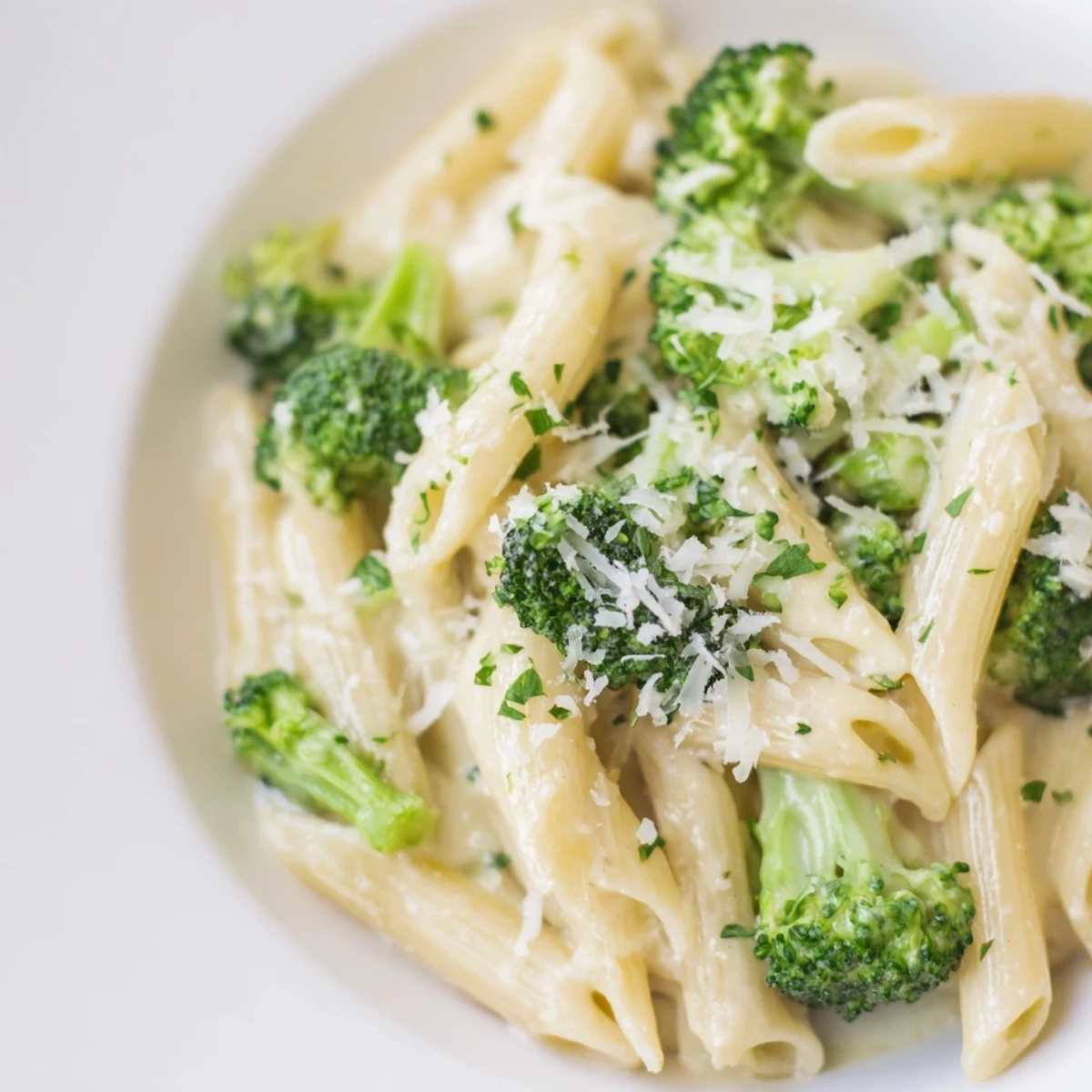 Enjoy a steaming bowl of Cream Cheese Garlic Pasta, a comforting vegetarian Italian-American meal.