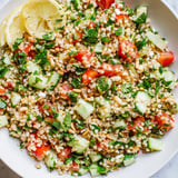 A close-up of a refreshing tabbouleh grain bowl, perfect for a light vegetarian lunch option.