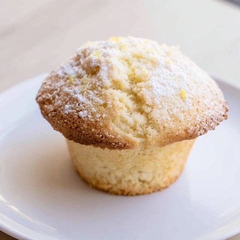 A basket of baked fluffy quark muffins, golden brown, ready for a delicious breakfast.
