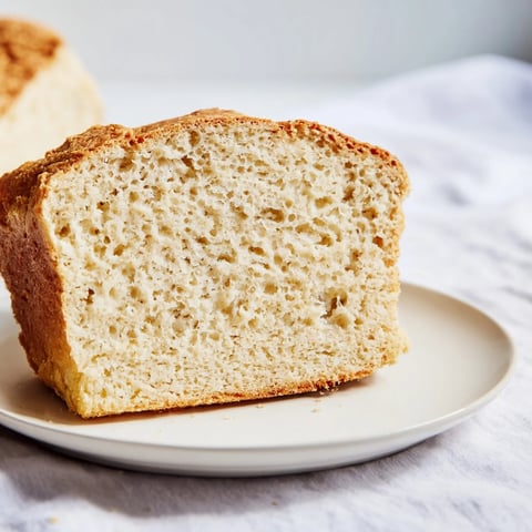 Golden-brown Beer Bread Family Loaf, fresh from the oven, offering a tempting, crusty texture.