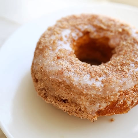 Fluffy cinnamon-sugar baked donuts, warm and coated for a delicious American dessert.