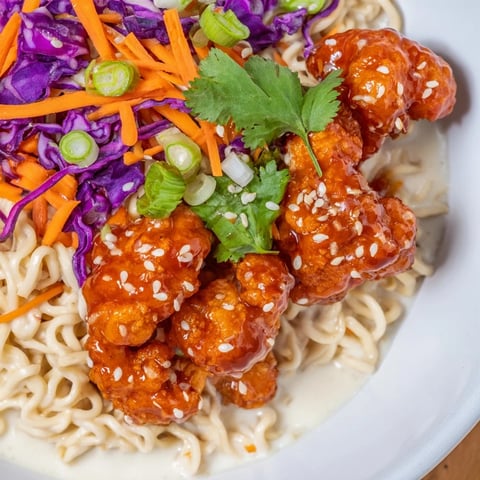 Crispy buffalo cauliflower ramen, a comforting bowl with creamy broth and vibrant toppings, ready to enjoy.