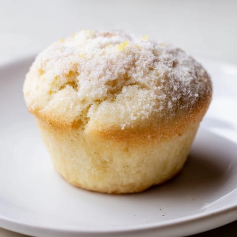 Close-up image shows the soft, tender crumb of freshly baked fluffy quark muffins with a subtle tang.