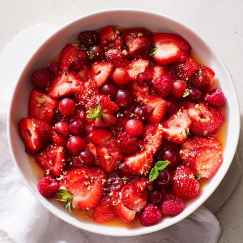 This colorful Festive Poinsettia Fruit Bowl is a stunning and refreshing fruit salad for your holiday brunch.