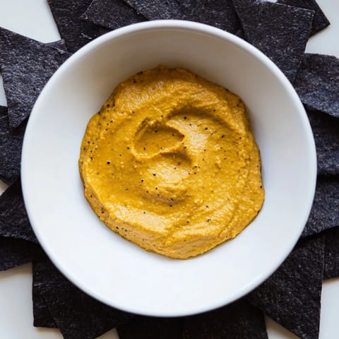 Enjoy the unique flavors of "The Midnight Sun"-- creamy carrot dip and crispy charcoal crackers.