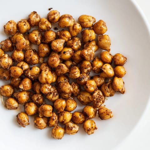 Crispy Chickpea Snack: A close-up of perfectly roasted chickpeas, showcasing their delightful savory crunch.