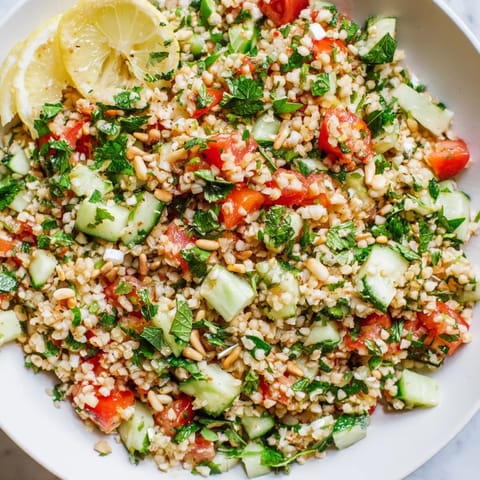 A close-up of a refreshing tabbouleh grain bowl, perfect for a light vegetarian lunch option.