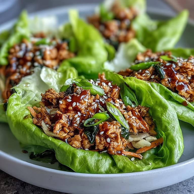 Colorful bowl of turkey stir-fry with shredded cabbage and carrots, ready to scoop into lettuce for Turkey Potsticker Stir-Fry Lettuce Wraps.