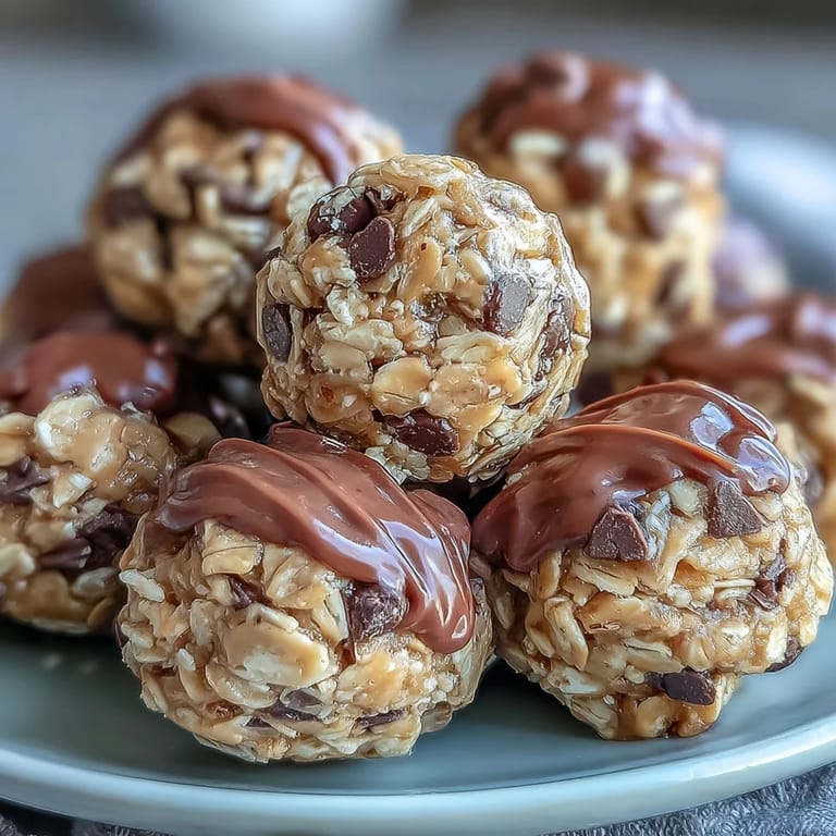 1. Wholesome no-bake oat bites with creamy peanut butter and mini chocolate chips, perfect for a quick energizing snack on the go.  